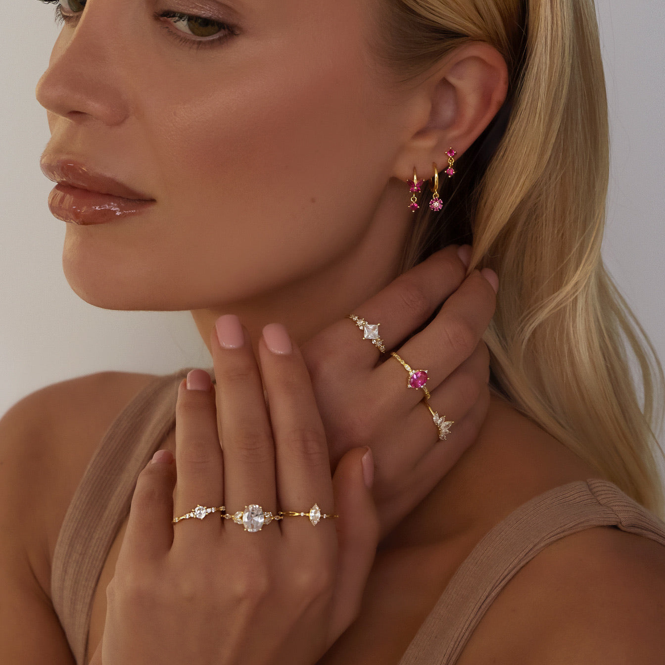 Sterling silver cubic zirconia detailing earring with drop down flower design in gold and pink. Adrianna hoop earrings- Lephoria