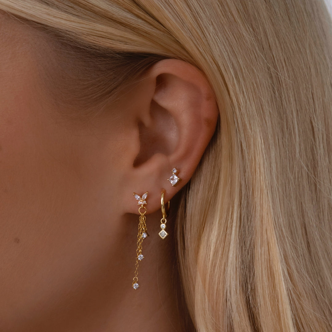 Sterling silver butterfly studs with drop down dainty chain and cubic zirconia detailing in gold. Aire stud earrings- Lephoria