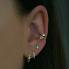 Sterling silver hoops in gold with a diamond shape cubic zirconia and smaller cubic zirconia detailing. Alexia hoop earrings- Lephoria 